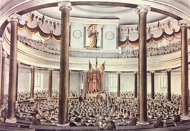 Paulskirche, Nationalversammlung 1848 Unknown sourceUnknown source, CC0, via Wikimedia Commons Lizenz: <https://creativecommons.org/publicdomain/zero/1.0/deed.en> <https://commons.wikimedia.org/wiki/File:Bilderrevolution0252.jpg>